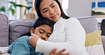 Mental health, mother and girl on sofa with support, parent comfort and help with anxiety trigger. Love, childcare and family in house with embrace, tender moment and empathy with sad emotions.