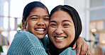 Portrait, mother and child at house with hug, love and parental affection for bonding together. Smile, woman and daughter in home with embrace, appreciation and childcare for weekend break in lounge