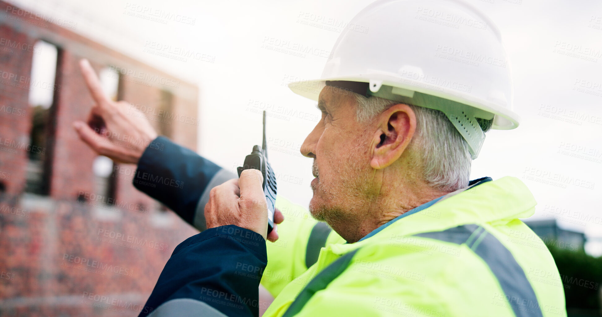 Buy stock photo Civil engineer, radio and man at construction site, building development or point for coordination. Talk, mature person and planning for architecture project, inspection or communication outdoor