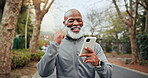 Fitness, man and celebration with phone outdoor for health app, cardio record and pace target. Earphones, mature black person and happy with tech for exercise speed, goals  and fist pump for results
