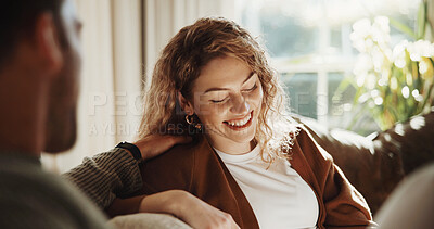 Buy stock photo Woman, couple and relax in home with smile, love and partner support for bonding together. People, laughing and unwind in lounge with spouse, comfortable and relationship commitment for weekend break