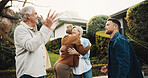Happiness, hug and family outdoor by new house for celebration, excited and parents with adult daughter. Embrace, pride and home investment with senior people, men and son with cheers for win