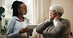 Neck pain, old woman and physiotherapist with tablet in home for rehabilitation support. App, conversation and injury with chiropractor speaking to senior patient for feedback, recovery or update