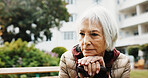Senior, woman thinking and retirement outdoor with walking stick, balance aid and space for reflection. Pensioner, memory or nostalgia for past perspective, relax in nature or cane for mobility