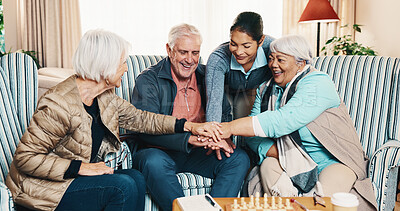 Buy stock photo Happy, senior or hands together with caregiver for unity, healthcare or support in retirement home. Group, nurse or piling with smile or stack in old age house for elderly care, inclusion or cohesion