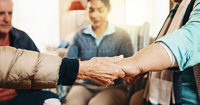 Buy stock photo Elderly, group and holding hands with caregiver for social support or praying together in house. Senior, people and therapy session with patients in circle or retirement home for faith, trust or love