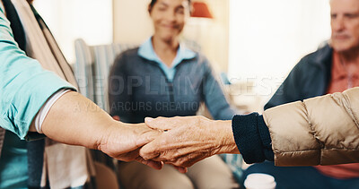 Buy stock photo Senior, group and holding hands with caregiver for social support or praying together in house. Elderly, people and therapy session with patients in circle or retirement home for faith, trust or love