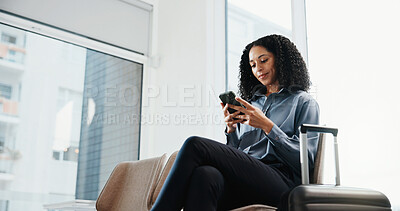 Buy stock photo Phone, suitcase and businesswoman in airport with typing, texting or email feedback on finance report. Travel, tech and financial advisor with luggage on cellphone for update on investment review.