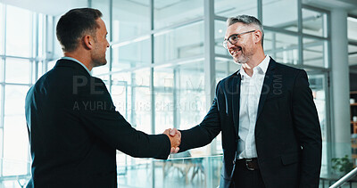Buy stock photo Businessmen, meeting and handshake in office for deal, introduction or business agreement together. Male people, employees or colleagues shaking hands with smile for b2b or partnership in workplace