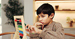 Bored, homework and child with abacus in home for maths lesson, learning and counting for education. House, tired and boy with educational toy for development, studying and knowledge with numbers