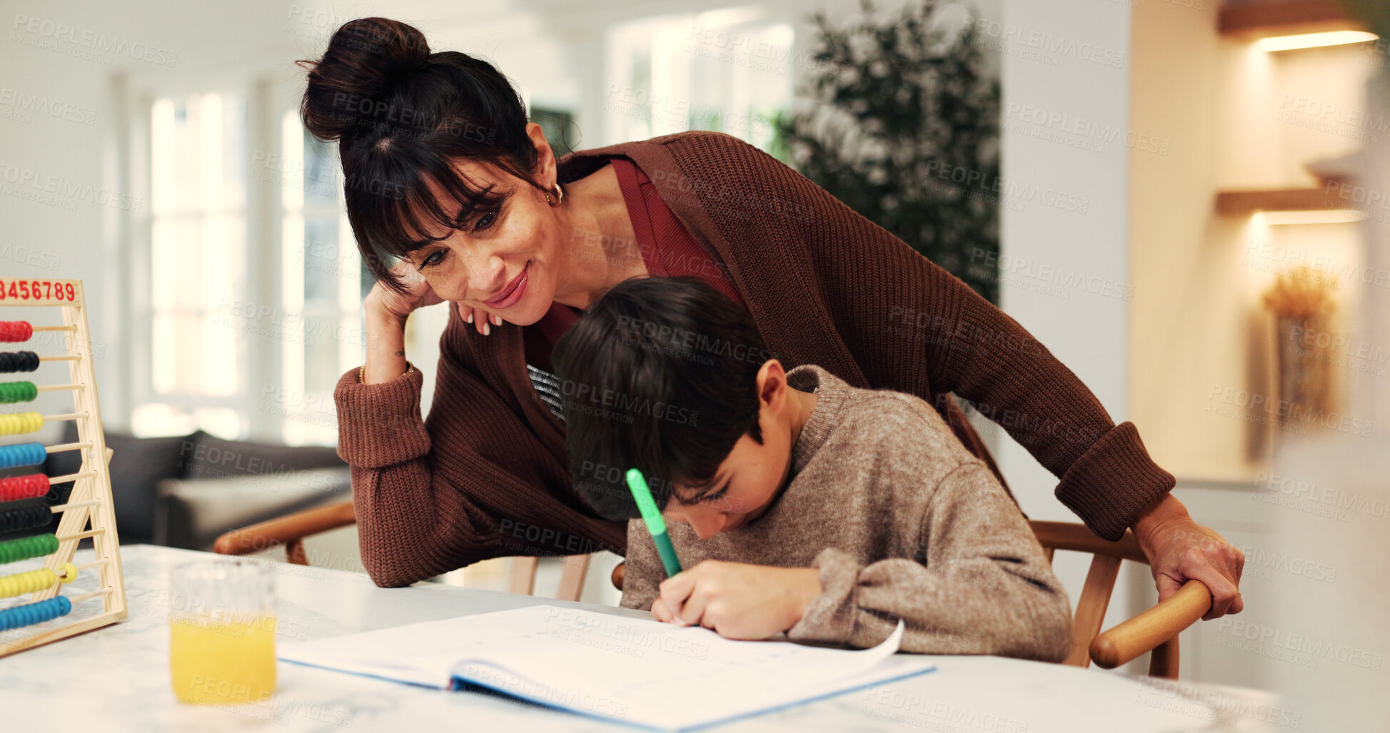 Buy stock photo Child, mother and writing with homework, support and book for math, knowledge or education in home. People, mom and boy for number assignment, learning and studying for development at family house