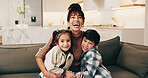 Mother, laugh and hug kids in home with happiness, bonding and portrait together with parent. Funny, mama and embrace children on sofa in living room for family connection, care and siblings relax