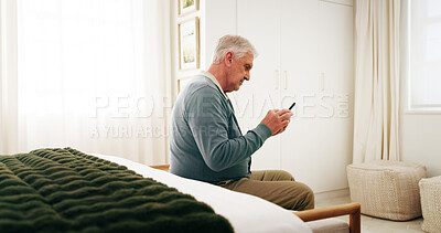 Buy stock photo Bedroom, chat and senior man with phone, serious and communication with contact on social media app. Reading, message and person with mobile on chair, retirement and networking on website in house