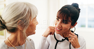 Buy stock photo Caregiver, stethoscope and happy woman with elderly support in home, heart healthcare and wellness. Retirement, medical volunteer and person with cardiology results, checkup and smile for good health