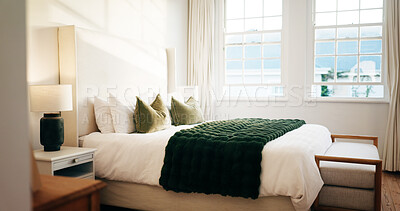 Buy stock photo Luxury, room and bed in hotel, hospitality and furniture with decor, real estate and interior design. Empty, accommodation and cozy blanket in bedroom, comfort and tidy motel or travel destination