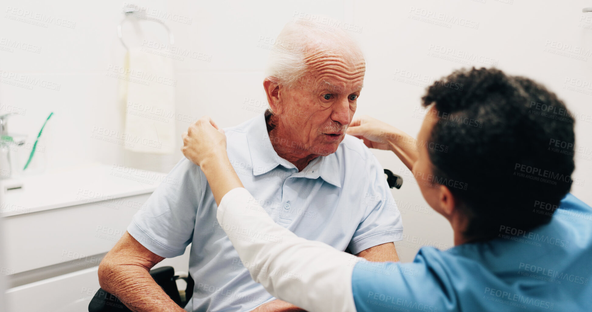 Buy stock photo Dressing, nurse or old man in bathroom with wheelchair, grooming or elderly care in assisted living. Caregiver, patient or senior person with disability, getting ready or support in nursing home.