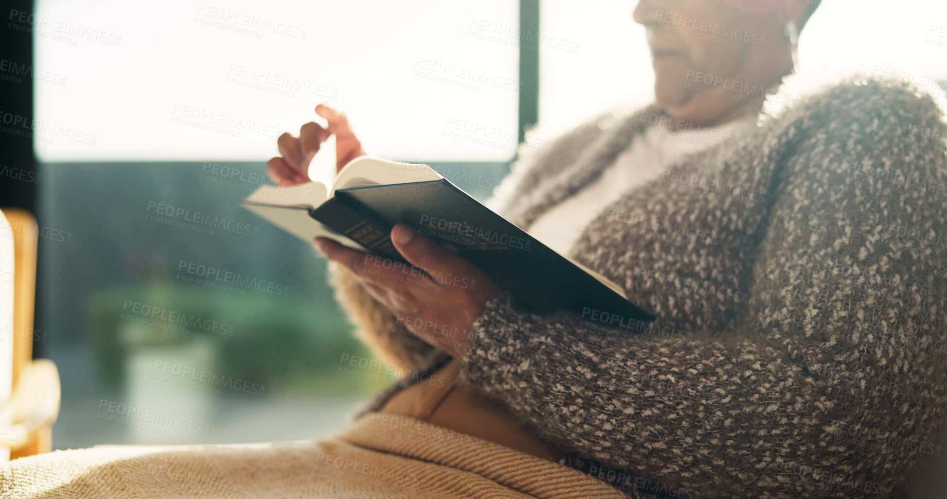 Buy stock photo Religion, reading and hands in house with bible, theology and sacred text with spiritual learning. Christian, insight and person with holy book, scripture study and wisdom in spirituality guidance.