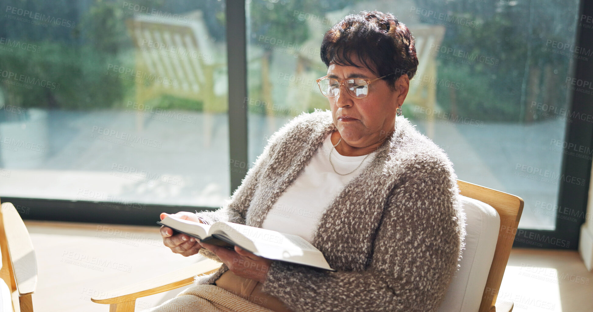 Buy stock photo Religion, bible or senior woman in home with reading, theology or sacred with spiritual learning. Christian, review or elderly person with holy book, scripture study or wisdom insight in retirement.