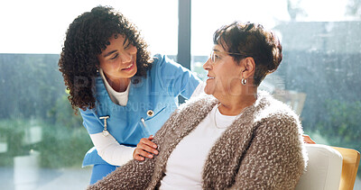 Buy stock photo Happy, conversation and nurse with senior woman in retirement home for medical checkup. Comfort, support and caregiver with elderly patient for healthcare service with advice at consultation in house