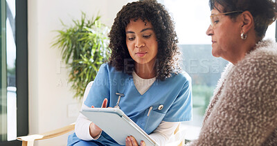 Buy stock photo Caregiver, reading and old woman at house with tablet, research or medical report for diagnosis. Nurse, checkup or senior person in home with digital, assisted living and online survey for healthcare