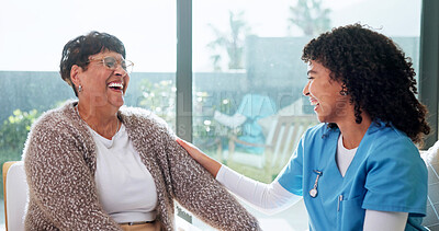 Buy stock photo Senior, woman and laugh in retirement home with caregiver, funny story or bonding together for wellness. Happy, pensioner and person in living room with nurse, healthcare support and joke to relax.