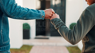 Buy stock photo Fist bump, hands and father with child outdoor at home for celebration of property investment. Family, bonding and dad with boy kid for connection, trust or good news on real estate purchase at house