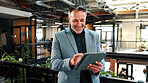 Man, realtor and tablet in office for smile, property management and service review. Mature, real estate agent and digital tech in agency for commission update, app scroll and research for reading