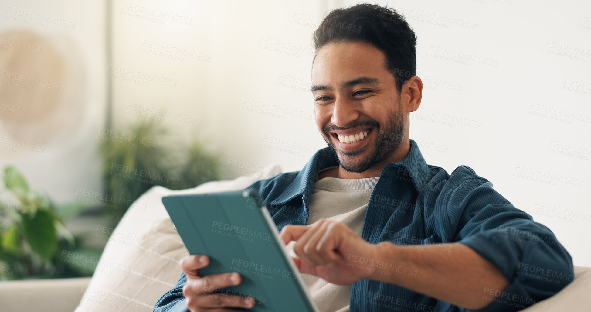 Buy stock photo Streaming, digital or man on couch with tablet, video subscription or post update on online site. Happy, relax or person in house with tech, internet search or show binge on entertainment platform.
