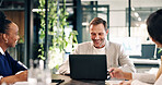 Smile, laptop and business people in meeting, planning and brainstorming ideas for profit in office. Computer, happy group and mature sales manager for project budget, finance and revenue growth