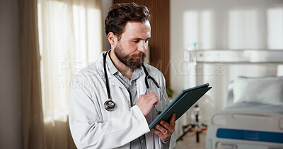 Buy stock photo Reading, doctor and man with tablet in clinic for admin, insurance info and review report. Technology, medical professional and male person with schedule, telehealth records or email in hospital room