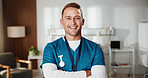 Portrait, man and nurse in hospital with arms crossed, career pride and smile for medical service. Happy, male person and about us at facility with ambition, nursing job and assistance for healthcare