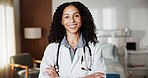 Doctor, confidence and woman in hospital room for healthcare, smile and career integrity in clinic. Portrait, female person and medical professional with arms crossed, happy physician and pride
