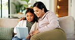 Tablet, smile and mother with child on sofa in home for playing educational game on app together. Happy, digital technology and mom with girl kid for online gaming with learning in apartment.