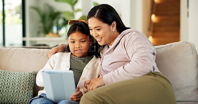 Buy stock photo Tablet, smile and mother with child on sofa in home for playing educational game on app together. Happy, digital technology and mom with girl kid for online gaming with learning in apartment.