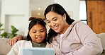Tablet, happy and mother with kid on sofa in home for playing educational game on app together. Smile, digital technology and mom with girl child for online gaming with learning in apartment.