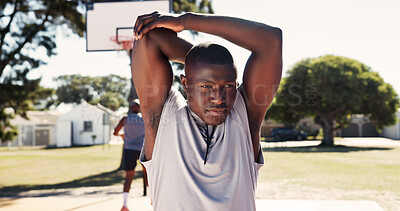 Buy stock photo Exercise, park and stretching with man on basketball court for game, practice or training. Fitness, start and warm up with sport athlete getting ready for competition, workout or performance outdoor