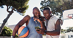 Exercise, app and phone with black people on basketball court for message, tracker and social media. Summer, excited and training with happy friends in park for health, tech and sport highlights