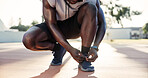 Fitness, start or hands on basketball court with shoelace, ready or footwear safety in practice session. Secure, sneaker prep or man with laces, sportswear check or injury prevention in outdoor sport