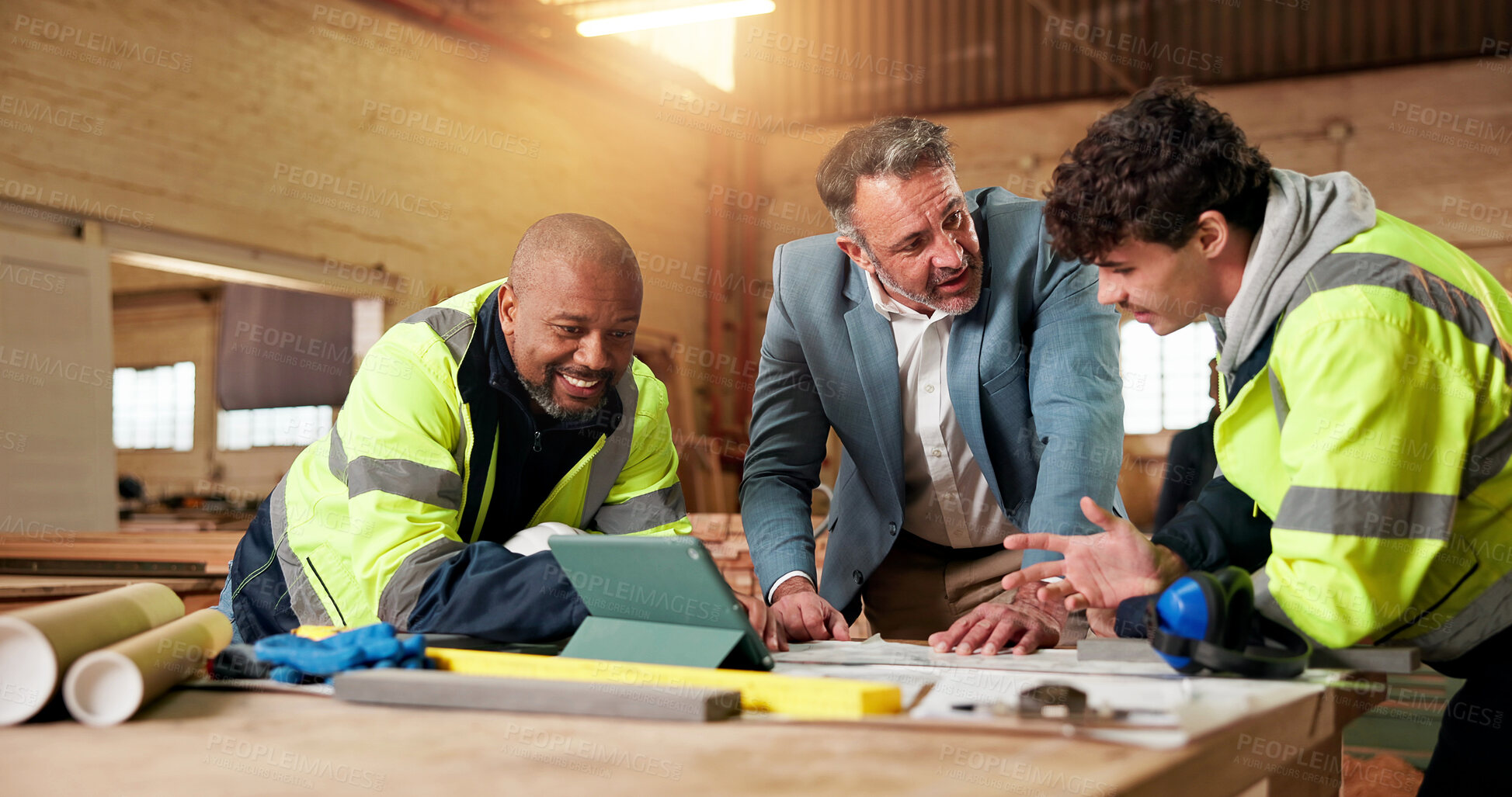 Buy stock photo Carpentry, team and tablet in workshop for planning, apprentice insight and mentorship with timber. People, supervisor and trainee with tech for design update, woodworking project and productivity