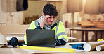 Construction, headache and laptop with man in carpentry workshop for timber supply problems. Computer, review and stress with carpenter person in woodworking factory for inventory or stock issue