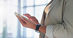 Phone, typing and hands of woman in office with email, update or feedback on finance report. Connectivity, technology and financial advisor with cellphone for texting on investment growth project.
