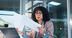Woman, laptop and finance with documents in office for performance review, results or statistics. Female person, analyst or checking paperwork with computer for financial assessment in workplace