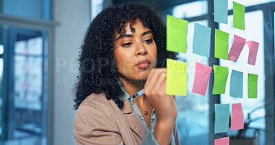 Buy stock photo Sticky notes, writing and businesswoman in office with research for creative project ideas. Planning, glass wall and magazine editor brainstorming with agenda for article at startup workplace.