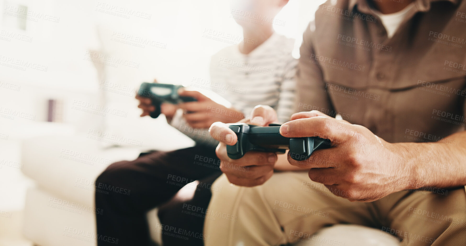 Buy stock photo Break, gaming and hands of parent with child on living room sofa for bonding, competition or fun. Hobby, remote control and video game with family in home together for learning, playing or teaching