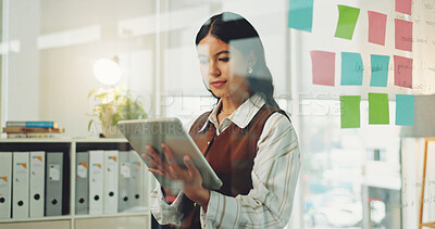 Buy stock photo Tablet, office or business woman by glass wall for commercial real estate, sales or rental lease. Tech, reading or person in company for property development, report or review listing on internet