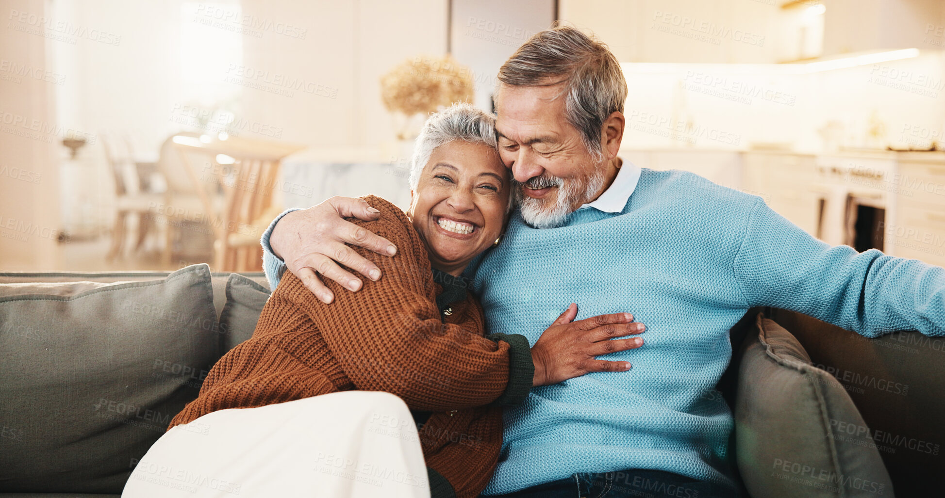 Buy stock photo Senior, couple and relax in living room with hug, smile and bonding together for retirement wellness. Portrait, happy married people and pensioner in home with embrace, romantic relationship or love.