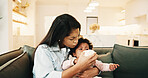 Bottle, relax and mother with baby in home with comfort, feeding or wellness for development. Health, bonding and mom with child in living room for nutrition, connection or growth with love in house.