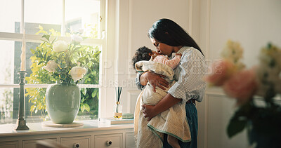 Buy stock photo Mother, window and kiss with baby girl in living room with hug, bonding and connection with care. People, mom and child for rest, love or relationship for security, comfort or support in family home