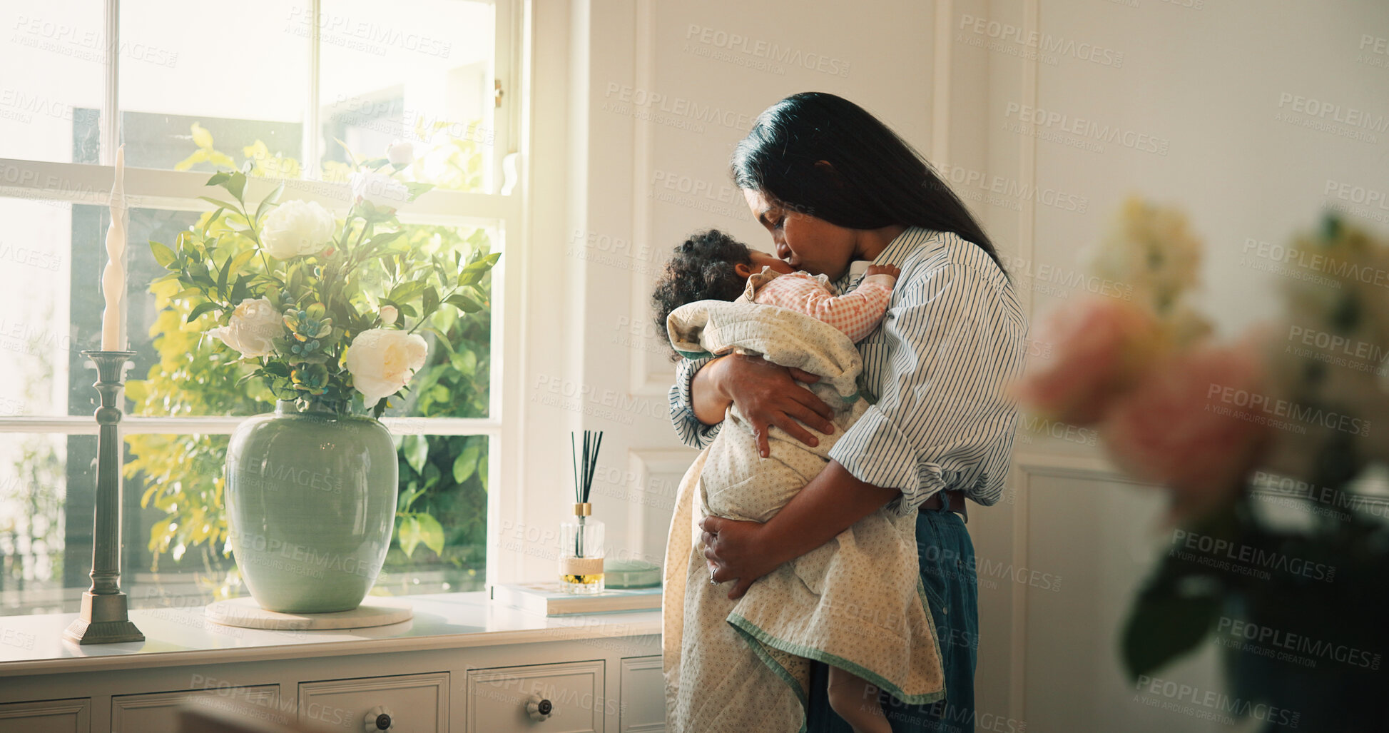 Buy stock photo Mother, window and kiss with baby girl in living room with hug, bonding and connection with care. People, mom and child for rest, love or relationship for security, comfort or support in family home