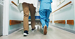 Legs, doctor and nurse push hospital bed for medical emergency, treatment or collaboration for help. Back, people and feet walk in clinic hallway with gurney, healthcare support or journey to surgery